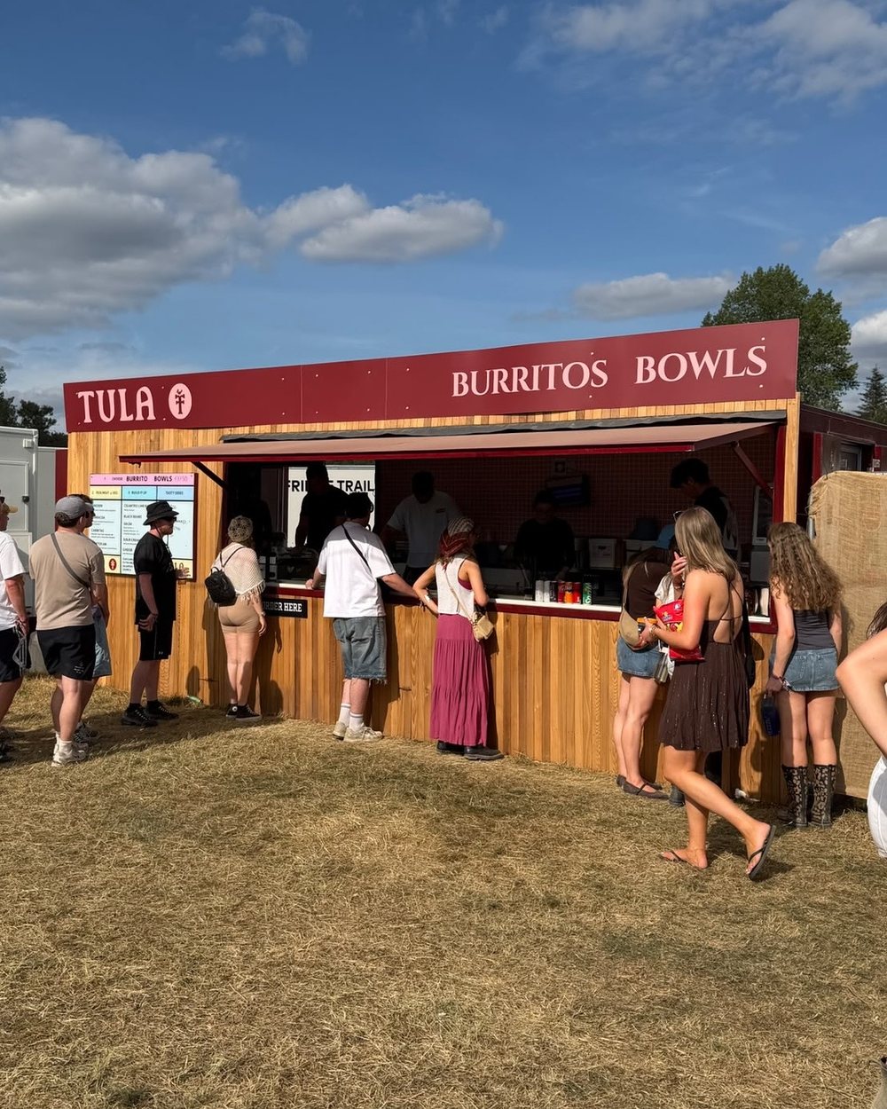 Customers queuing at the Tula Mexican Grill trailer at a festival